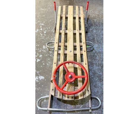Shane Lynch collection - Vintage wooden and metal sledge with steering wheel and brakes, L118cm W54cm 