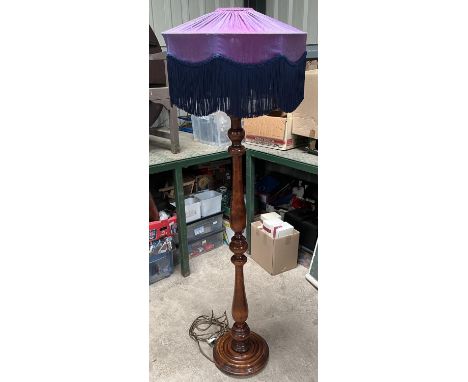 Edwardian style turned wooden standard lamp, on circular base with fringed shade, H166 max 