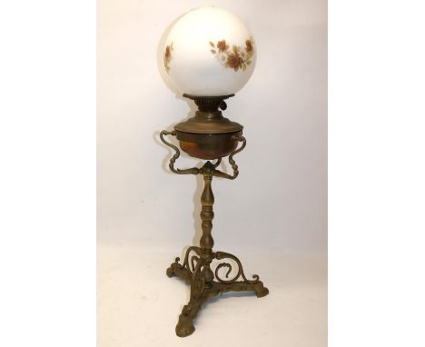 Three footed brass oil lamp with white glass transfer decorated shade, H55cm 