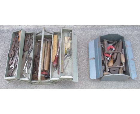 Two vintage metal tool boxes, each with an assortment of tools 