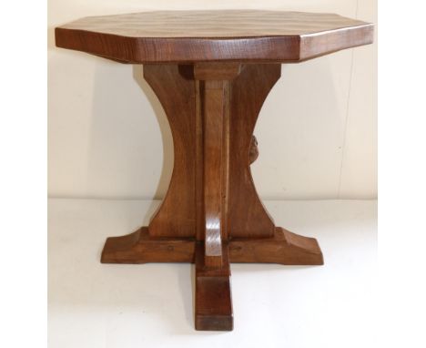 Robert Mouseman Thompson of Kilburn - an oak octagonal coffee table, adzed top on cruciform column support, H47cm W50cm 