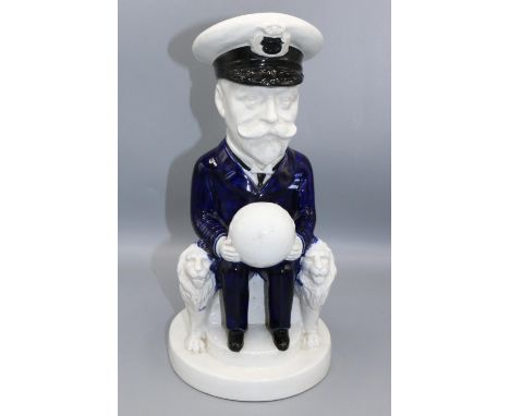 Wilkinson Ltd (Royal Staffordshire Pottery) King George V toby jug, designed by Sir Francis Carruthers Gould, modelled seated