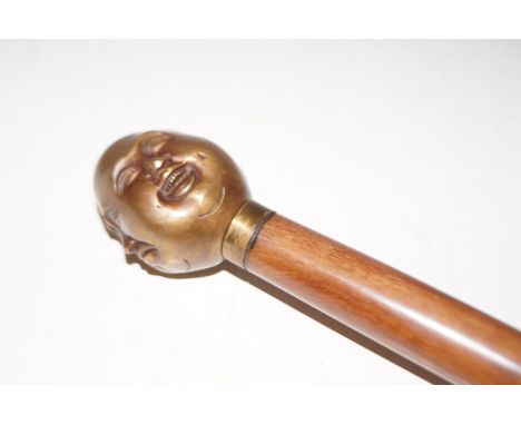 Brass four faced Buddha walking stick