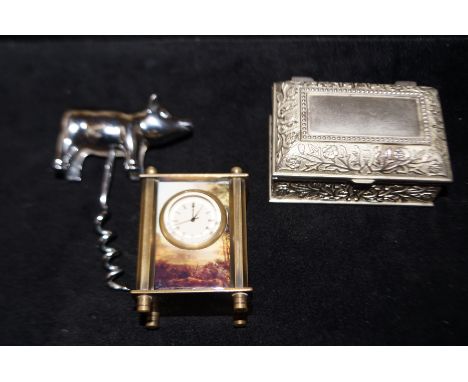 Trinket box novelty bottle opener together with a miniature carriage clock 