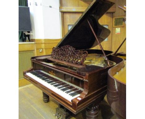 Steinway (c1900)A 6ft 11in 88-note Model B grand piano in a rosewood case on square tapered legs.  AMENDMENT Is on turned and