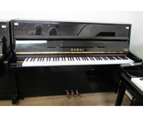 Kawai (c2012)A Model K-15 upright piano in a bright ebonised case.