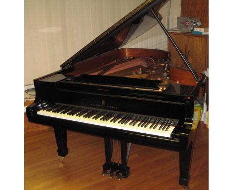 Steinway (c1971)A 7ft 5in Model C grand piano in a bright ebonised case on square tapered legs; together with a cover.