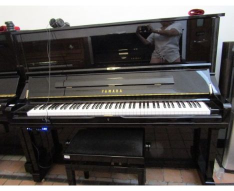 Yamaha (c2015)A Model U3SH upright piano in a bright ebonised case; together with headphones and matching stool