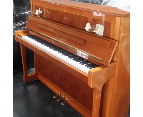 Schimmel (c1987)A Model 121 upright piano in an antique style walnut case.  AMENDMENT Is together with a matching stool.