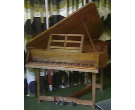 Arnold Dolmetsch (c1953)A harpsichord in a triangular mahogany case with a four foot and harp stops.