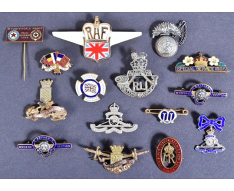 A collection of assorted British Military and other pin / cap badges and sweetheart brooches to include; Royal Artillery swee