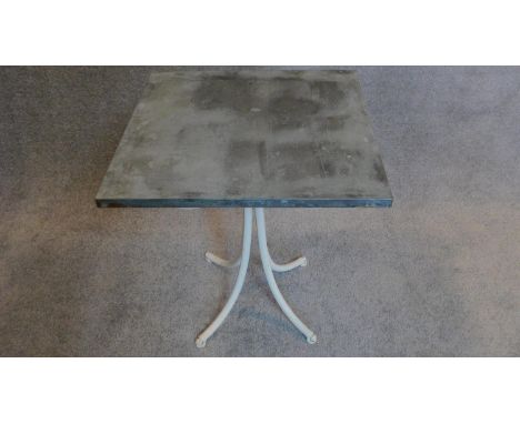 A painted metal garden table with pewter top. H.65 W.54cm 