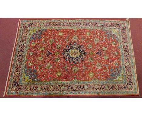 A northwest Persian sarouk mahal carpet, central double pendant medallion with repeating spandrels and petal motifs within st