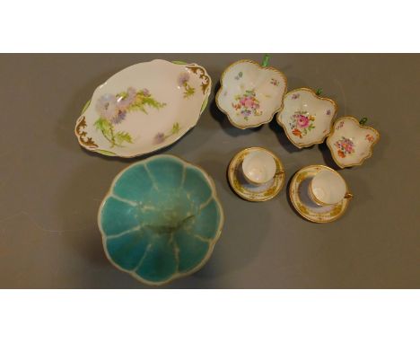 A collection of ceramics to include a painted and signed serving dish, a set of three hand painted leaf shaped dishes, a pair