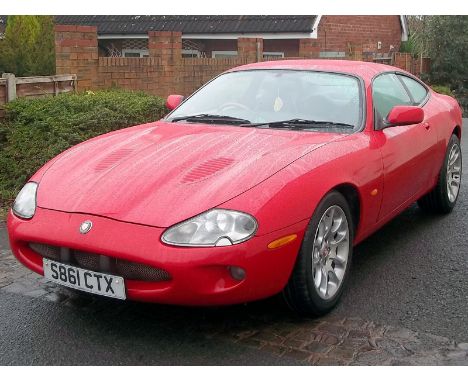 1998 Jaguar XKR                                                      - Finished in Red, Black leather interior and supercharg