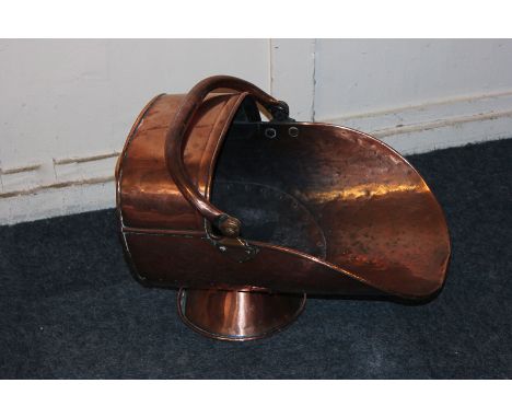 A copper helmet shaped coal scuttle, 43cm