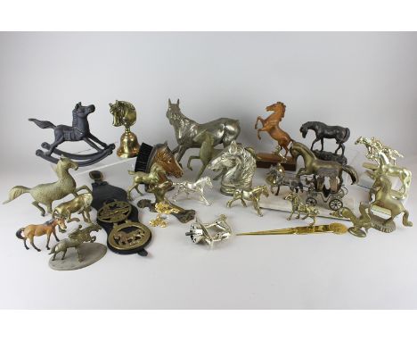 A collection of brass and other material horse figures, horse brasses, bells, a brush and a door knocker