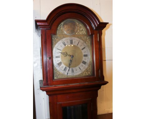 A reproduction mahogany long case clock with 10 inch arched dial, inscribed Tempus Fugit, with Westminster chiming movement, 