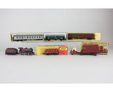 A collection of Fleischmann and other N-Gauge model railway including three locomotives and various carriages and trucks, mos