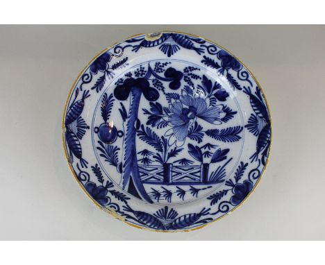 A 19th century Delftware charger (a/f), 32cm