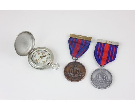 Two RMP and City of Chichester March medals dated 1980 and 1981, together with a pocket compass by F Barker & Son