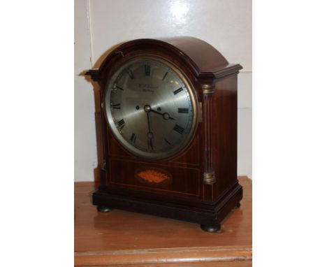 An Edwardian mahogany cased bracket clock by W J Vincent, Worthing, with shell inlaid case, the silverised dial with Roman nu