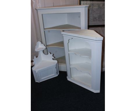 A white painted corner cupboard with detached unpainted door, 74cm, and two smaller painted corner shelf units