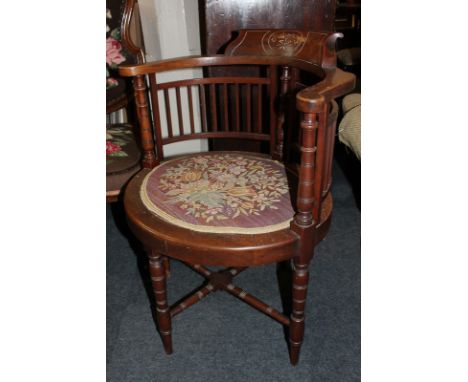 A Victorian tub chair with slatted back and oval tapestry seat