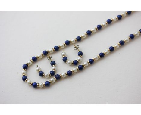 A lapis lazuli bead and cultured pearl necklace on a 9ct gold clasp and beads and a pair of matching earrings