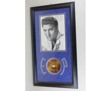 A framed hair of Elvis Presley together with a photographic print and three sets of framed Elvis monthly magazines