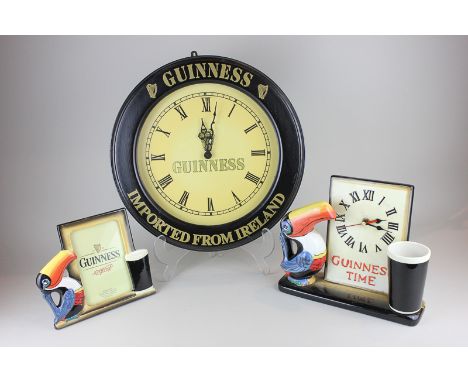 A porcelain Guinness clock, a porcelain Guinness photo frame and Guinness pub clock, 37.5cm diameter