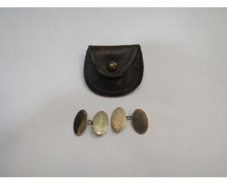 A pair of 9ct gold on silver engine turned cufflinks 