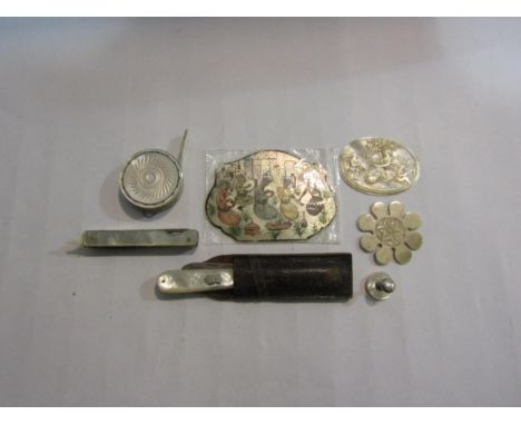 A silver folding pen knife with mother of pearl handle. A selection of mother of pearl items and a bone thread winder 