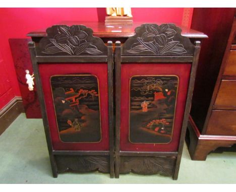 A Japanese laquered two-fold table top screen, figural and pagoda scenes together with a laquered panel depicting figures of 