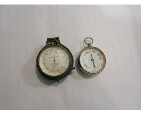 A brass cased pocket aneroid barometer, with altitude ring, by Callaghan & Co, London 6.5cm diameter.  In half a leather - co