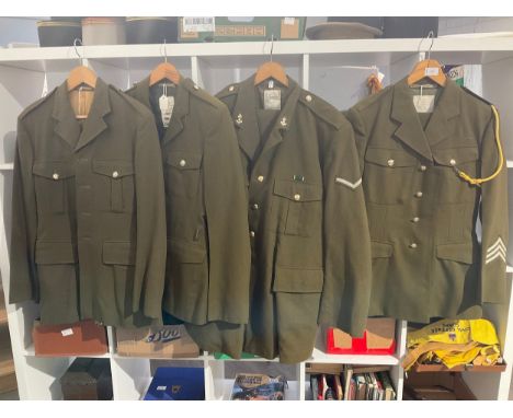 Four post war British army no. 2 service dress jackets, two with trousers, one with insignia 