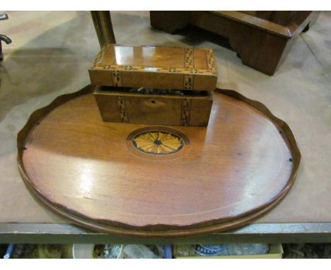 An Edwardian inlaid mahogany oval tray with brass and wavy edge handles (a/f).  A Victorian walnut tea caddy with parquetry b