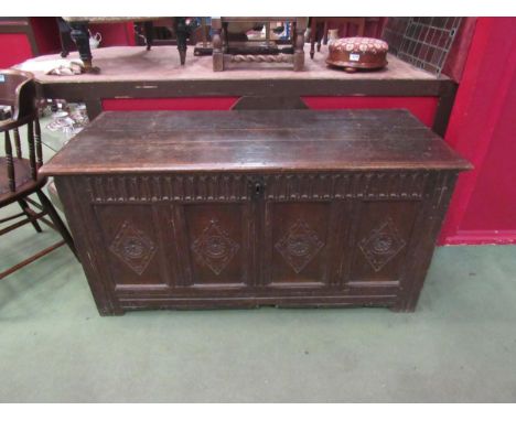 A late 18th Century four panel carved oak coffer, 63cm high x 130cm wide x 57cm deep 