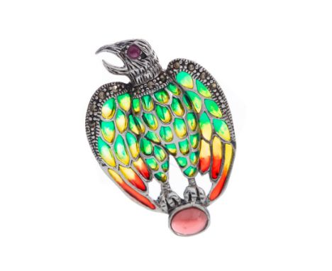 PLIQUE A JOUR EAGLE BROOCH, with a round ruby eye and green, yellow and red enamelled wings bordered by marcasites, perched u