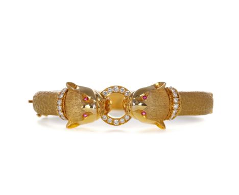 DIAMOND SET PANTHER BANGLE, modelled as two panther heads with diamond set collars gripping a diamond set ring, each with rub
