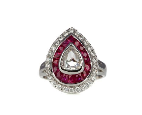 RUBY AND DIAMOND RING, set with a central rose cut pear shaped diamond of approximately 0.60 carats within a double ruby and 