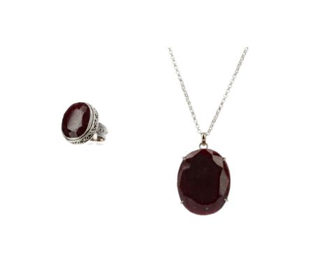 LARGE RUBY PENDANT, set with an oval ruby of approximately 125.00 carats, on a silver chain, along with a ruby ring of approx