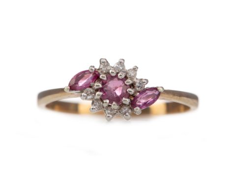 RUBY AND DIAMOND RING, the round ruby flanked by two marquise shaped rubies and round brilliant cut diamonds totalling approx