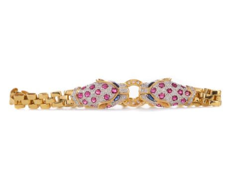 SAPPHIRE, RUBY AND DIAMOND PANTHER BRACELET, formed by two ruby and diamond set panther head, with sapphire eyes, with diamon