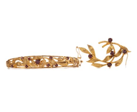 GARNET BROOCH, set with round red garnets, in nine carat gold, 4.8g, along with a nine carat gold bangle of similar design, 1