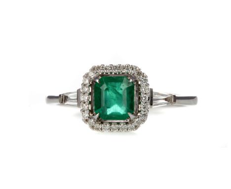 EMERALD AND DIAMOND RING, set with an octagonal step cut emerald of approximately 0.97 carats, within a round brilliant cut d