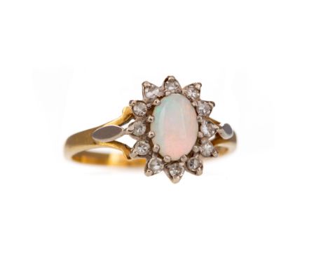 OPAL AND DIAMOND RING, the oval opal within a halo of round brilliant cut diamonds totalling approximately 0.25 carats, in ei