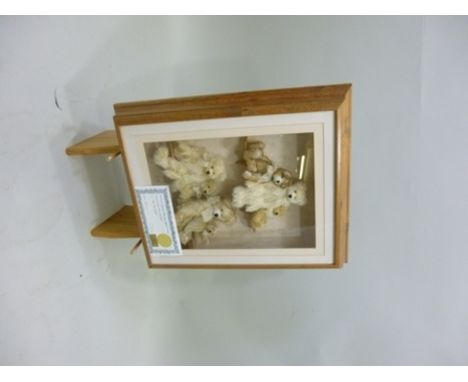 A FRAMED COLLECTION OF TEDDY BEARS "Box Your Bears", titled "On The Shelf" designed and made by Alison McGaham, signed and nu