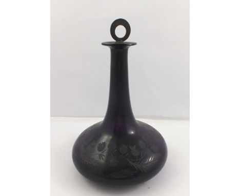 A 19TH CENTURY AMETHYST BLOWN GLASS DECANTER of onion form with engraved thistle and trailing frond decoration, ground pontil