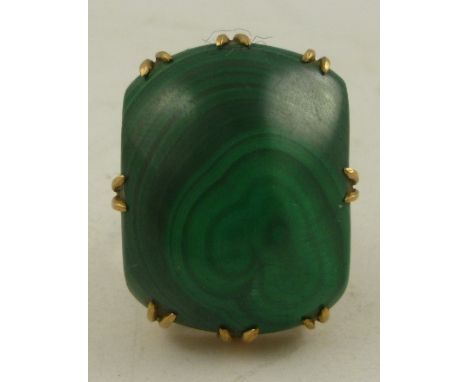 A MALACHITE AND GOLD COLOURED METAL MOUNTED 8/8 DRESS RING, in claw setting, size M 